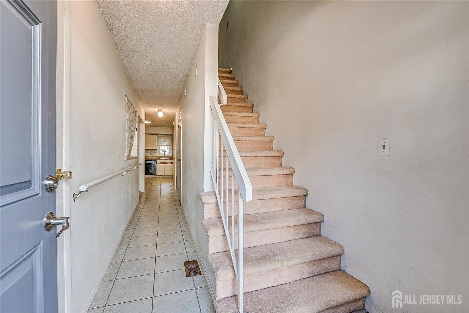 4702 Hana Road Edison, NJ 08817 - Photo 3 of 28 a view of entryway and hall with wooden floor