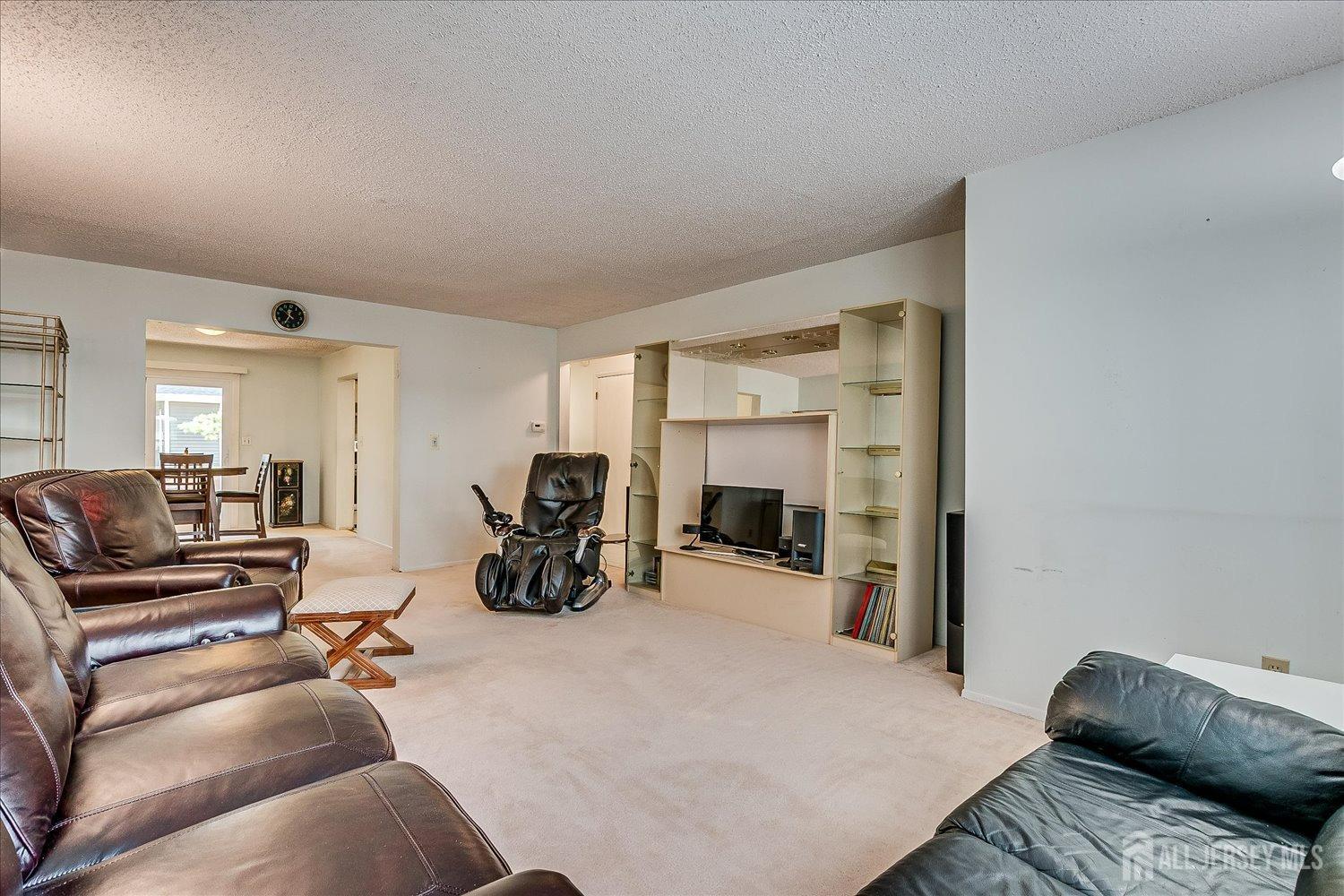 4702 Hana Road Edison, NJ 08817 - Photo 7 of 28 a view of a livingroom with furniture and a living room