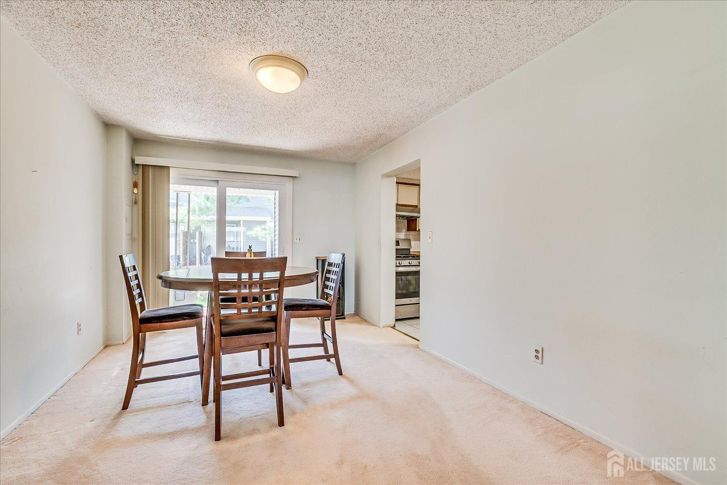 4702 Hana Road Edison, NJ 08817 - Photo 8 of 28 a view of a livingroom with furniture and window