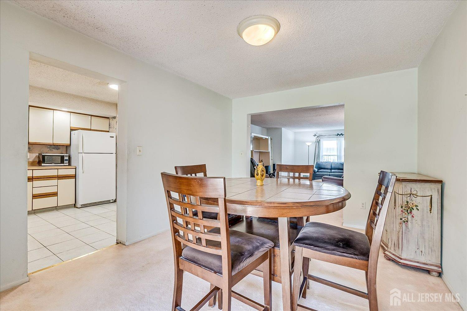 4702 Hana Road Edison, NJ 08817 - Photo 9 of 28 a dining room with furniture and window