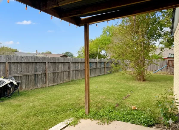 a view of a backyard with a small cabin