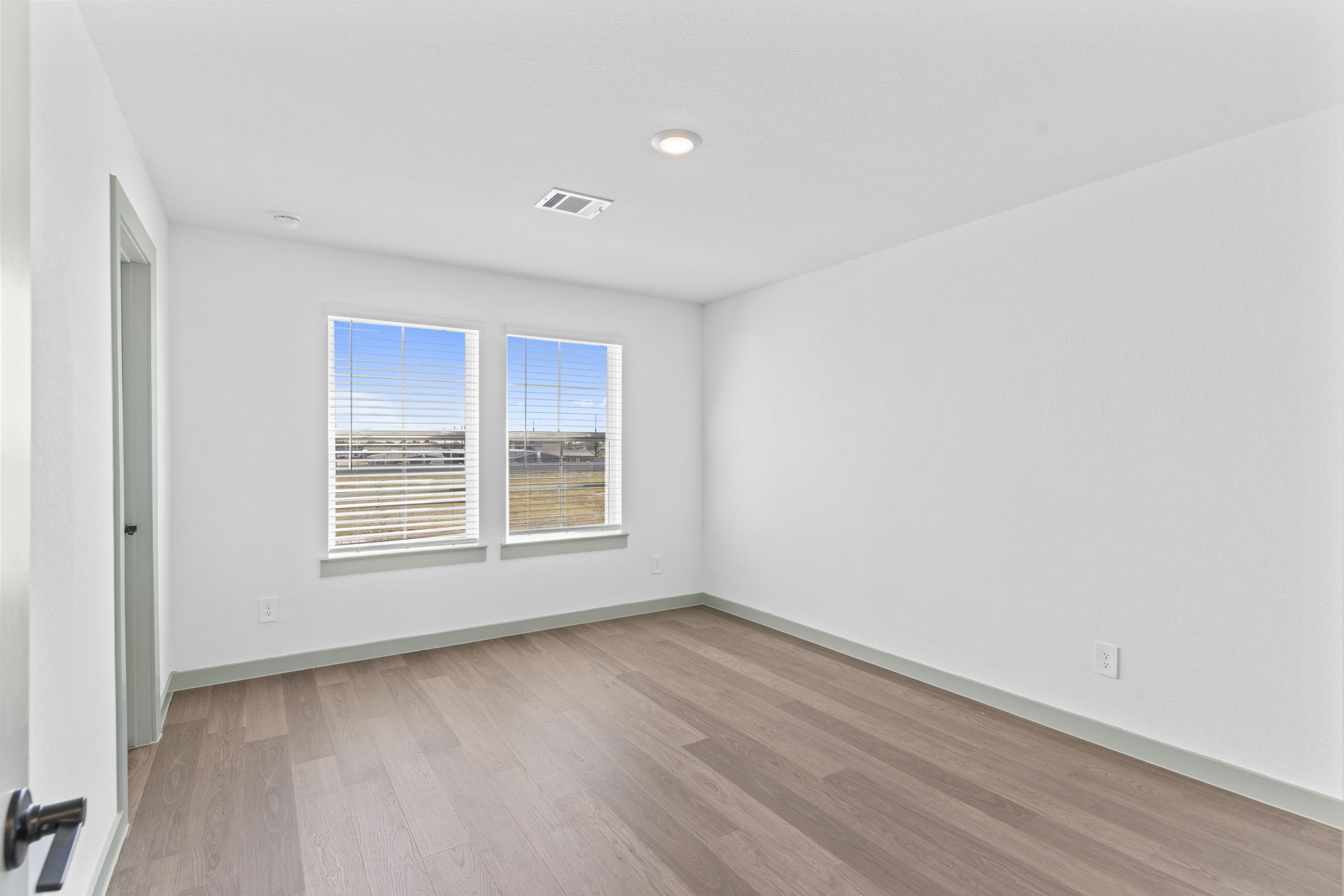 3305 Bolt Rope Drive Texas City, TX 77568 - Photo 16 of 30 an empty room with wooden floor and windows