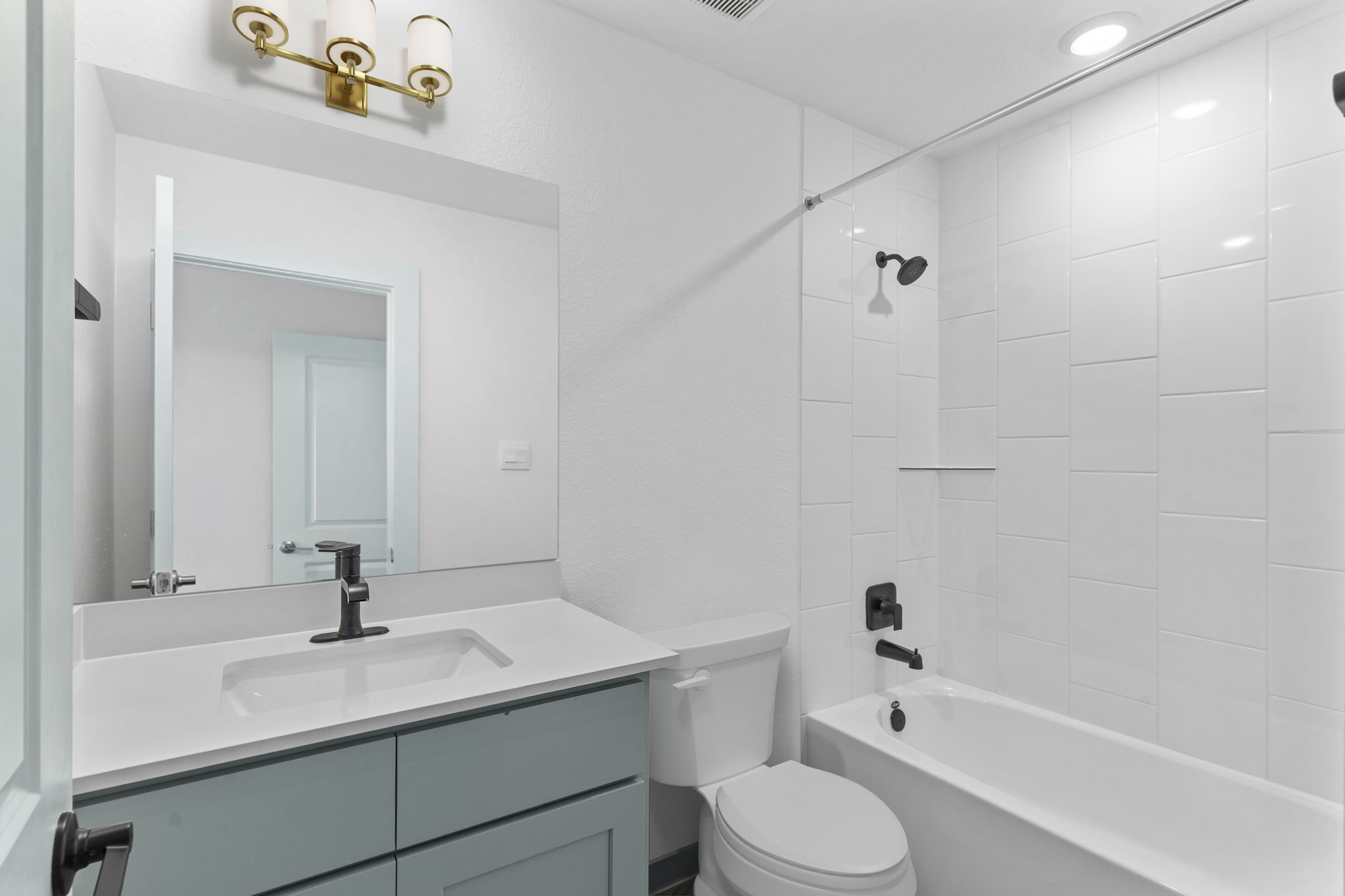 3305 Bolt Rope Drive Texas City, TX 77568 - Photo 17 of 30 a bathroom with a sink toilet a mirror and shower