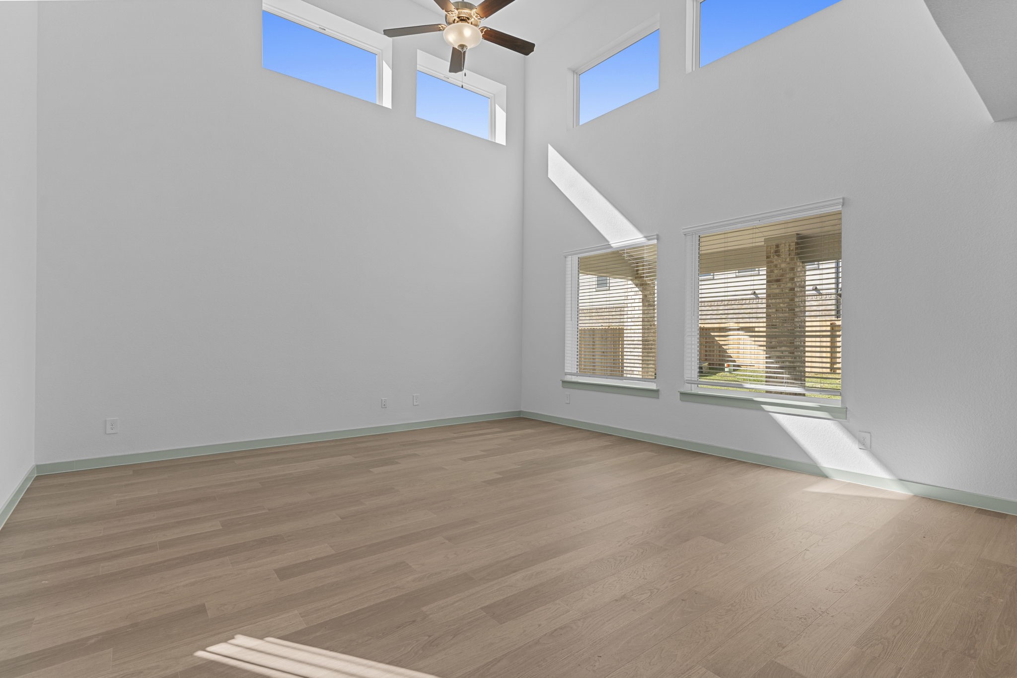 3305 Bolt Rope Drive Texas City, TX 77568 - Photo 6 of 30 an empty room with wooden floor and windows