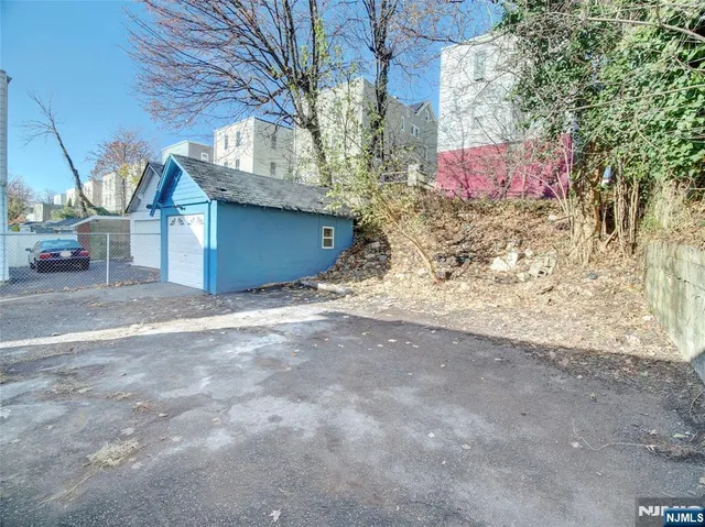 a view of a house with a snow in the yard