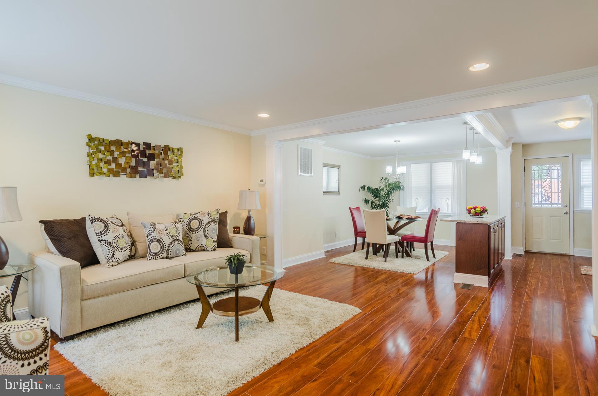 4645 Rokeby Road Baltimore, MD 21229 - Photo 3 of 30 a living room with furniture and a wooden floor