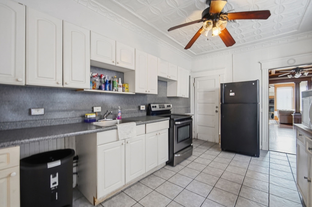 99-101 High Street Holyoke, MA 01040 - Photo 15 of 27 a kitchen with stainless steel appliances granite countertop a refrigerator and a stove top oven