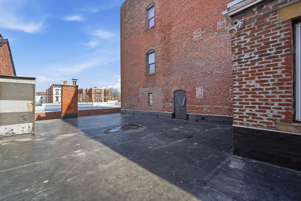 99-101 High Street Holyoke, MA 01040 - Photo 20 of 27 a view of a backyard with sitting area