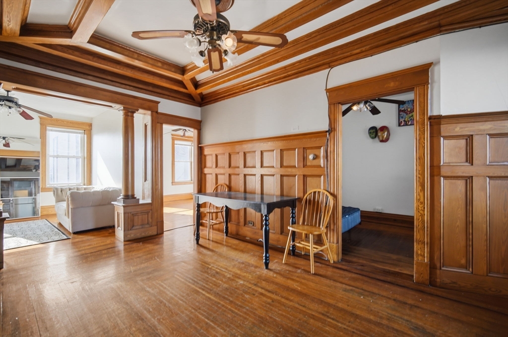 99-101 High Street Holyoke, MA 01040 - Photo 7 of 27 a view of a livingroom with furniture wooden floor and windows