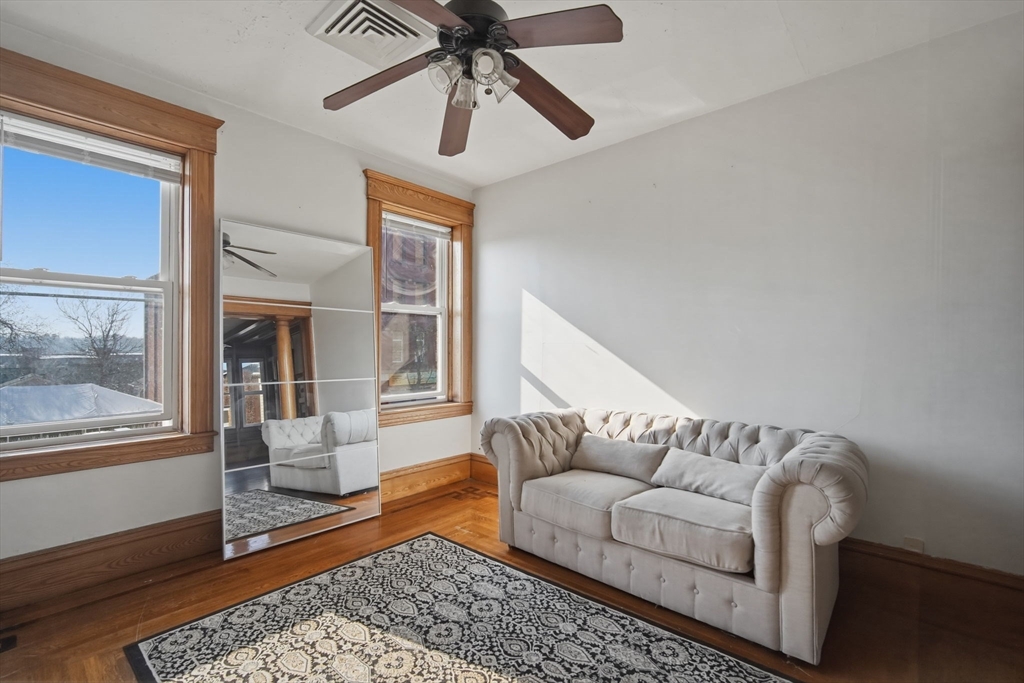 99-101 High Street Holyoke, MA 01040 - Photo 8 of 27 a living room with furniture and a window