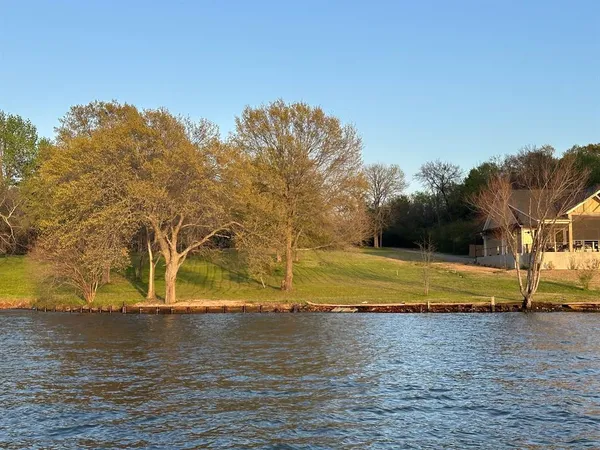 a view of a yard with an ocean