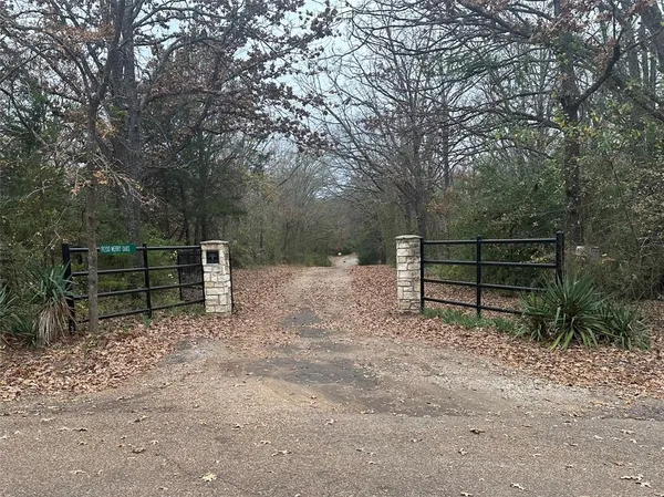 a view of outdoor space with wooden fence