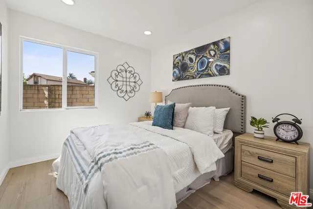 a bedroom with a bed and a table