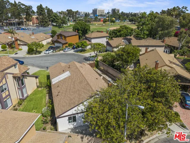 an aerial view of a house with a garden