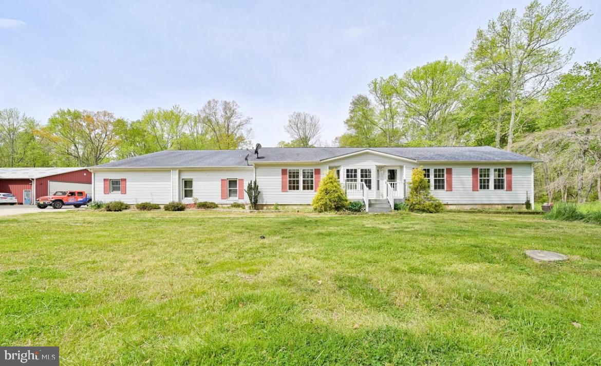 824 Hawks Bridge Road Salem, NJ 08079 - Photo 1 of 10 a front view of a house with a garden