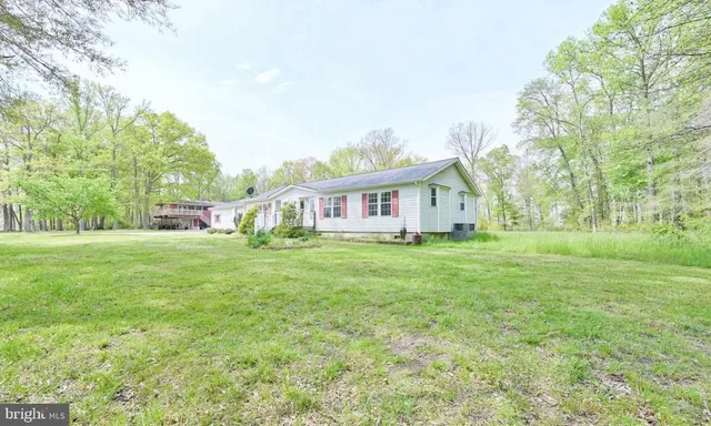 a view of house with yard and entertaining space