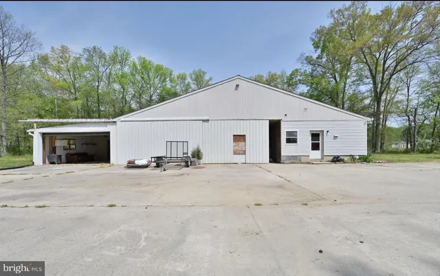 a view of a house with a outdoor space and garage