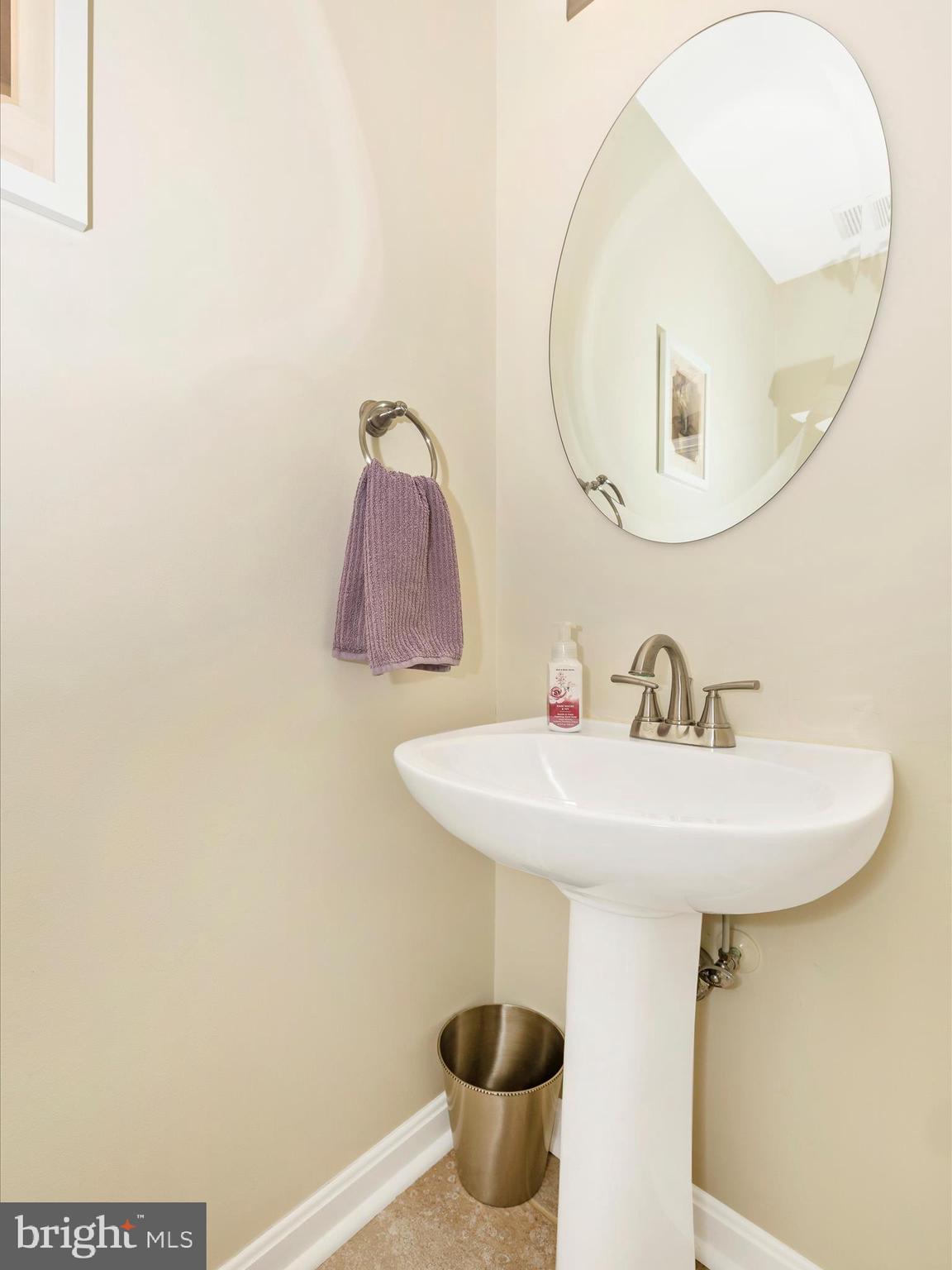 4945 Jalmia Road Mount Airy, MD 21771 - Photo 14 of 45 a bathroom with a sink and a mirror