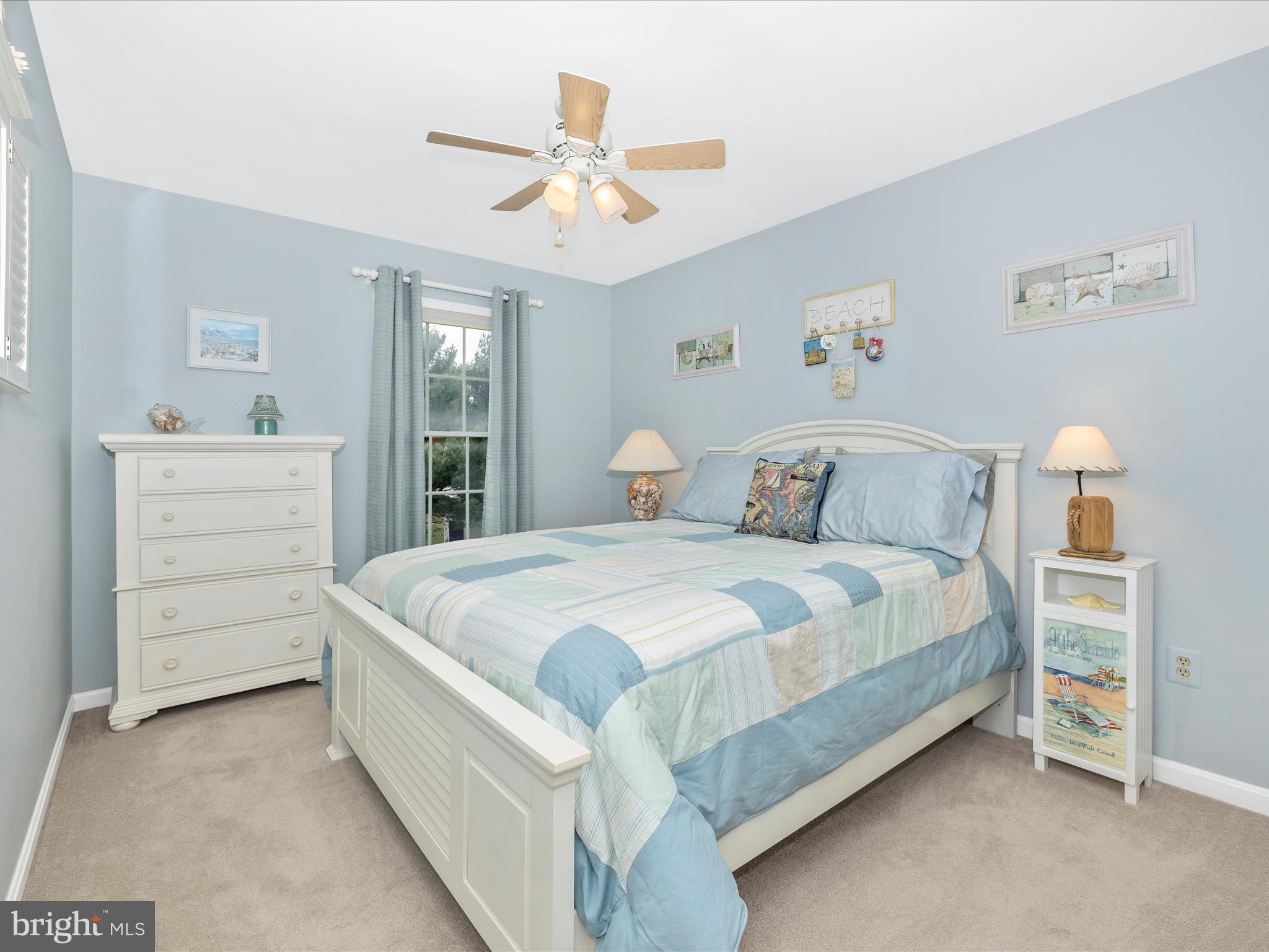 4945 Jalmia Road Mount Airy, MD 21771 - Photo 23 of 45 a bedroom with a bed and a chandelier