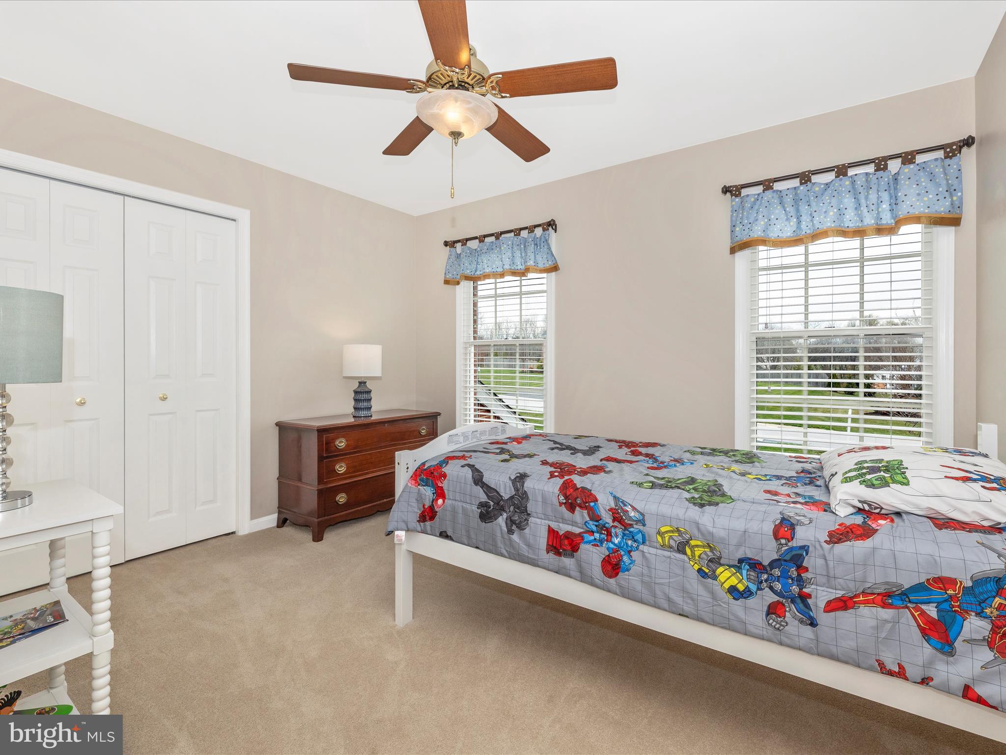 4945 Jalmia Road Mount Airy, MD 21771 - Photo 24 of 45 a bedroom with a bed and a chandelier