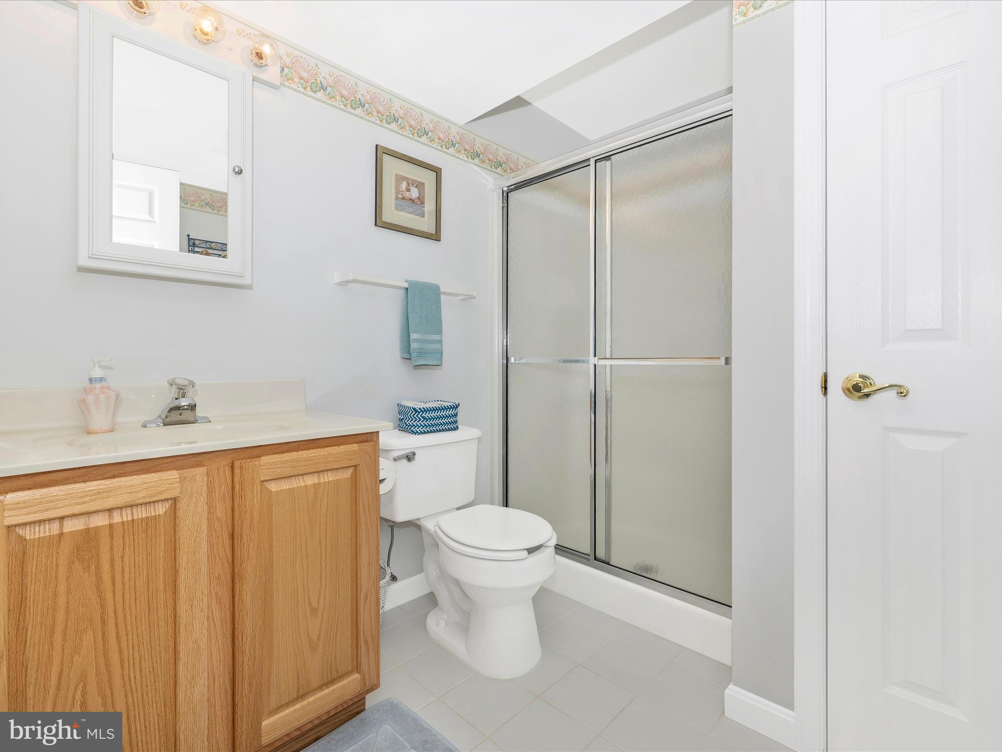 4945 Jalmia Road Mount Airy, MD 21771 - Photo 33 of 45 a bathroom with a toilet sink and a shower