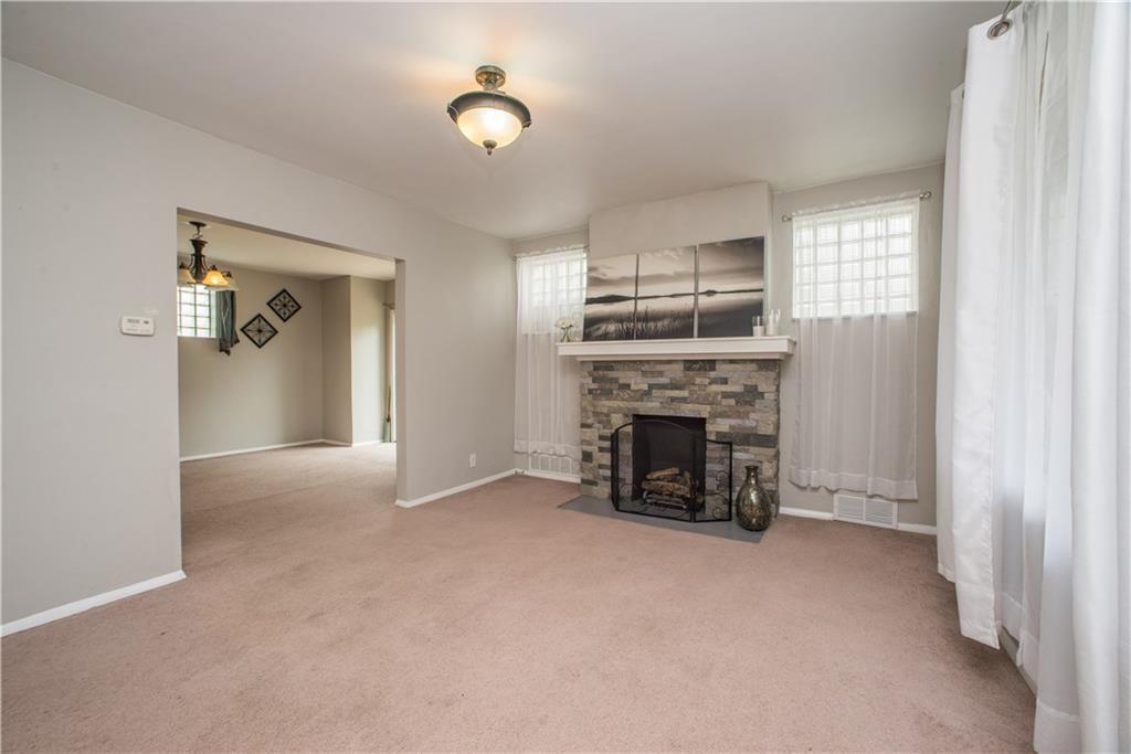 128 Marham Road Homestead, PA 15120 - Photo 11 of 24 A gorgeous stone decorative stone fireplace makes for a great focal point!