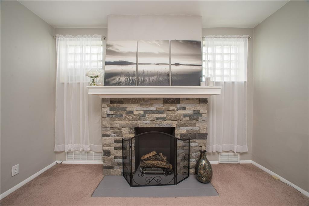 128 Marham Road Homestead, PA 15120 - Photo 13 of 24 A close up of the decorative fireplace.