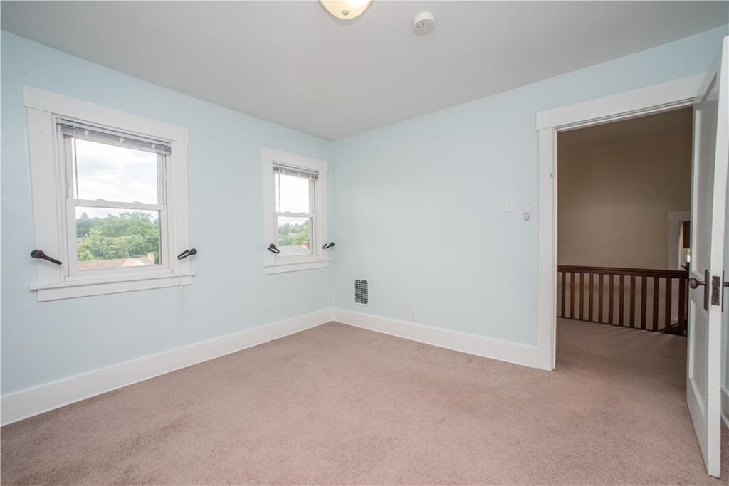 128 Marham Road Homestead, PA 15120 - Photo 22 of 24 Second bedroom is light an airy with this gorgeously serene blue.