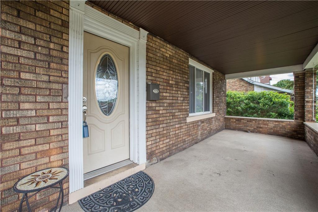 128 Marham Road Homestead, PA 15120 - Photo 8 of 24 Hurry up and add a porch swing - summer just started and porch is the perfect place to enjoy the weather.