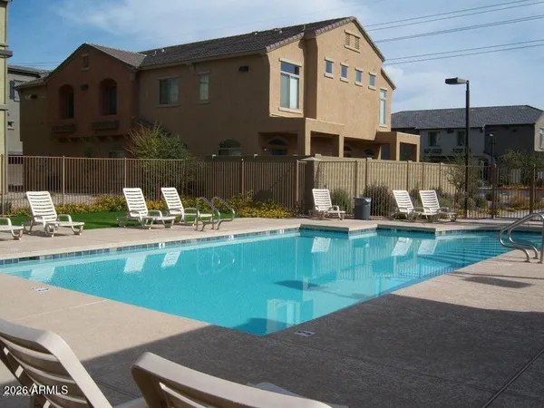 a view of a swimming pool with a patio
