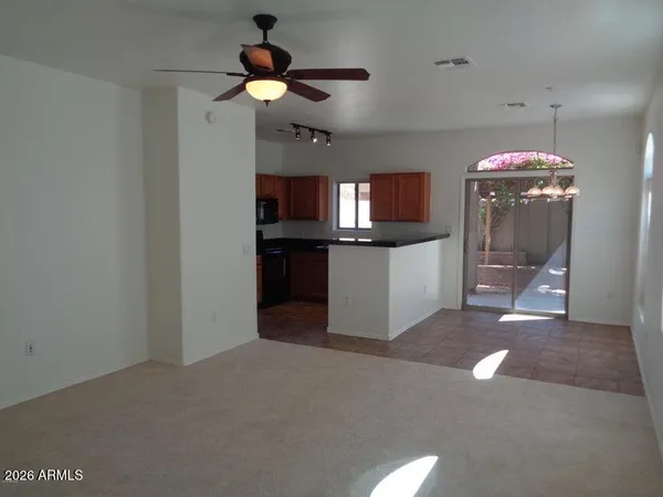 a kitchen with stainless steel appliances granite countertop a sink a stove and a refrigerator