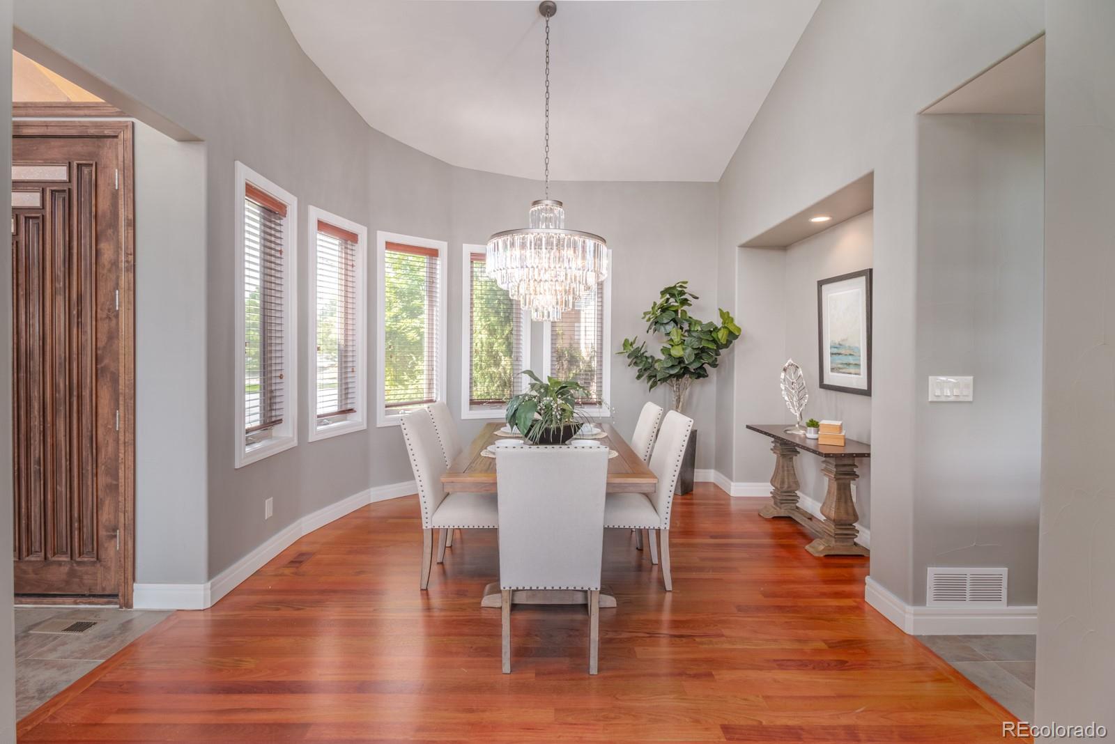 5241 Raintree Circle Parker, CO 80134 - Photo 12 of 36 a view of a dining room with furniture window and wooden floor