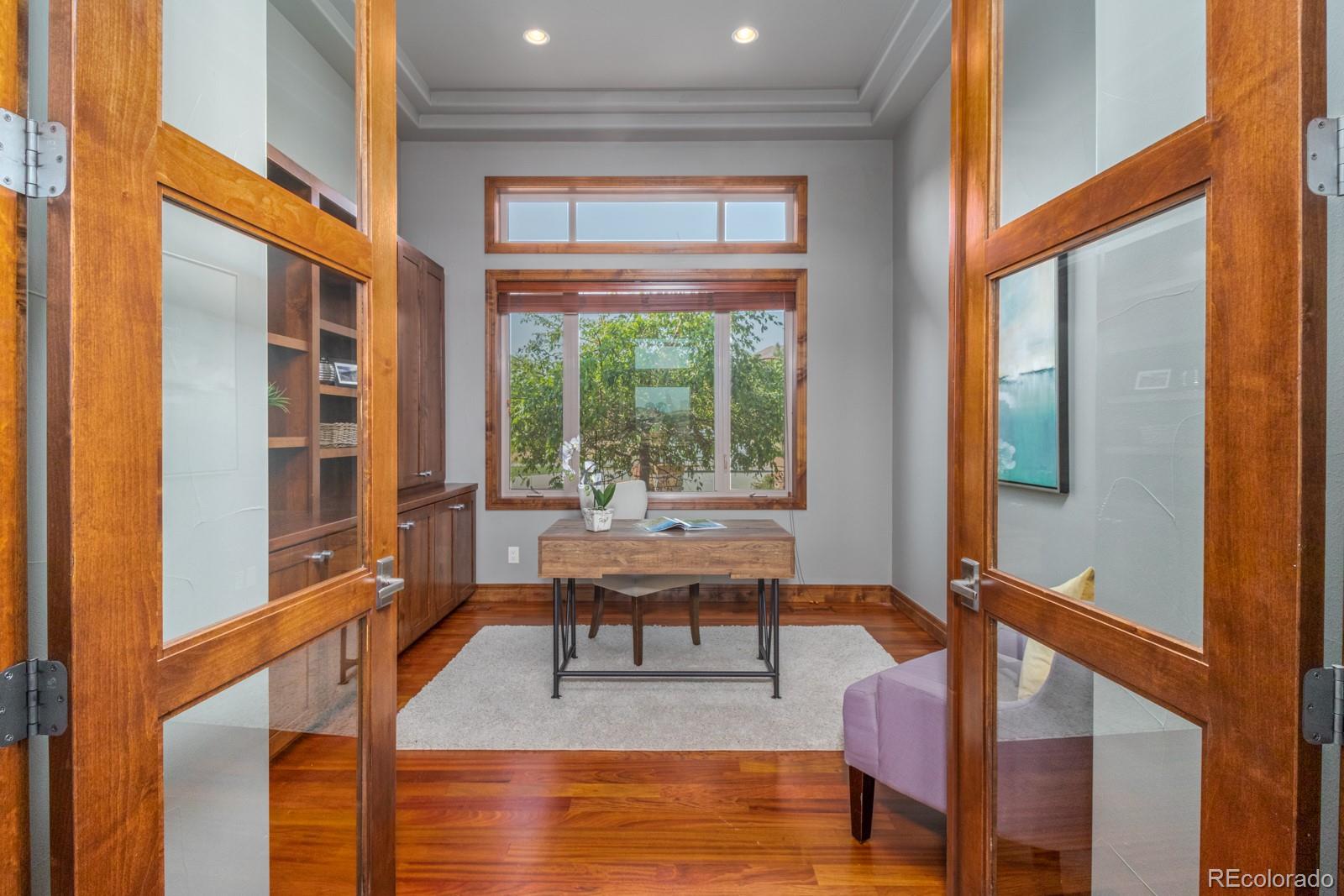5241 Raintree Circle Parker, CO 80134 - Photo 19 of 36 a living room with furniture and a large window