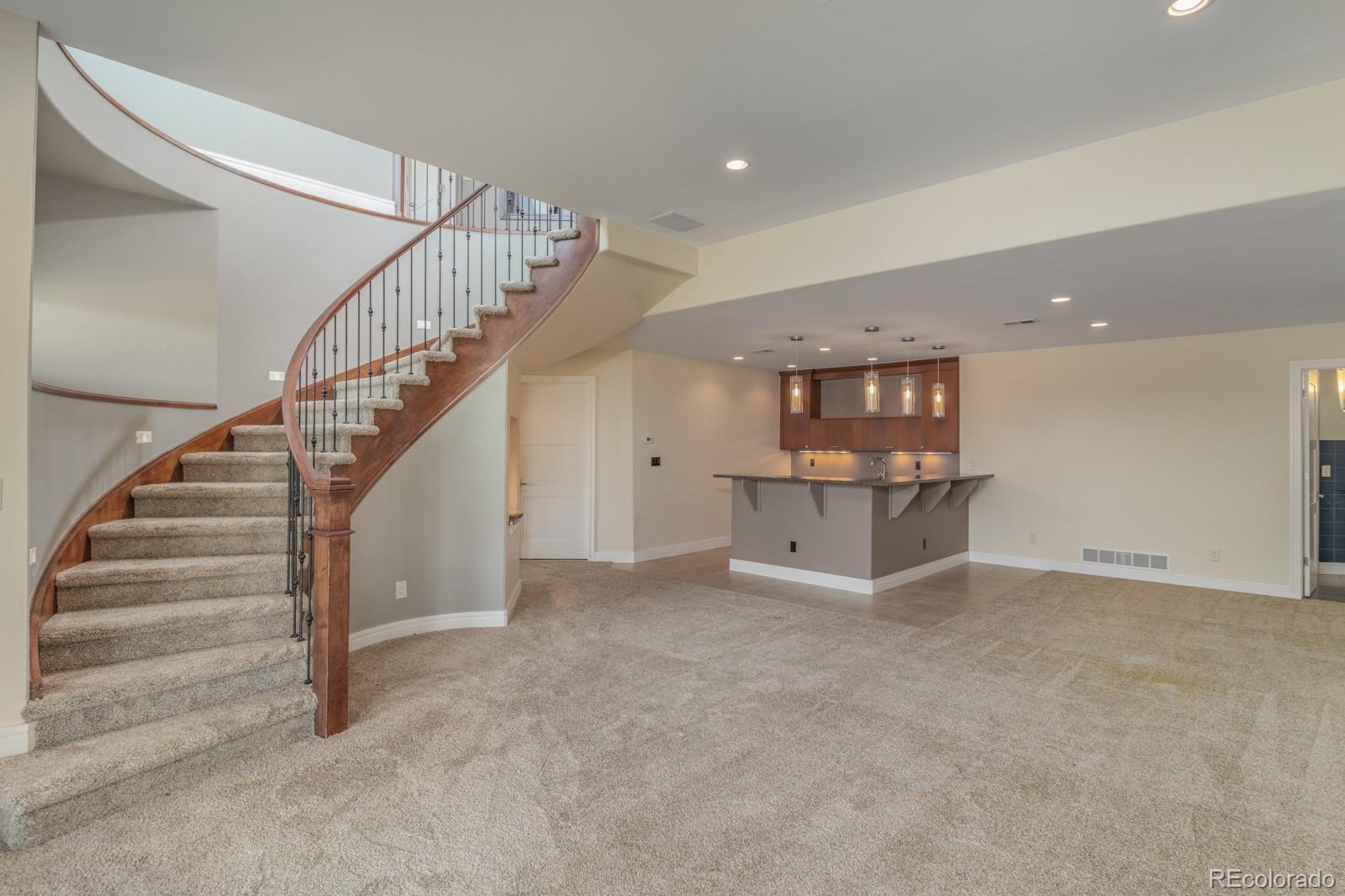 5241 Raintree Circle Parker, CO 80134 - Photo 22 of 36 a view of an empty room with stairs