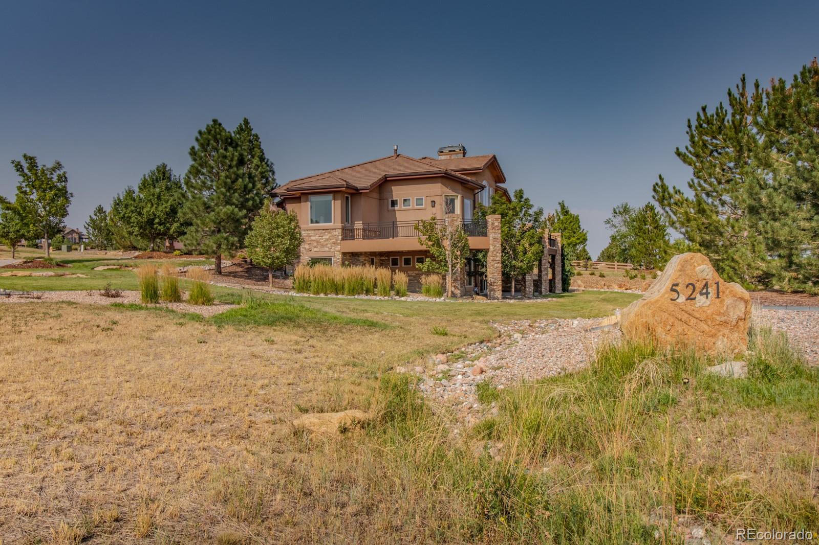 5241 Raintree Circle Parker, CO 80134 - Photo 30 of 36 a view of a house with a yard