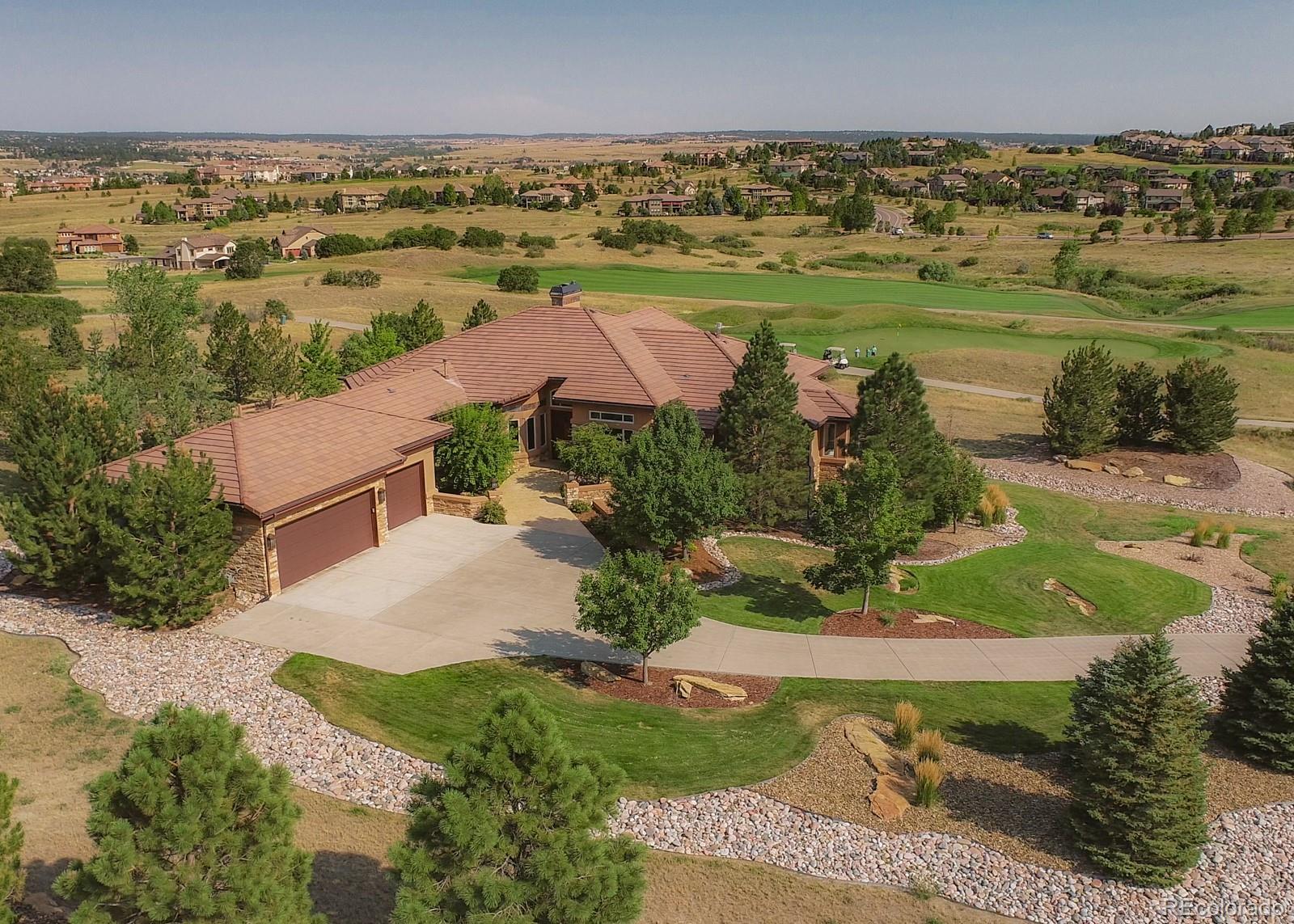 5241 Raintree Circle Parker, CO 80134 - Photo 32 of 36 an aerial view of residential houses with outdoor space and trees