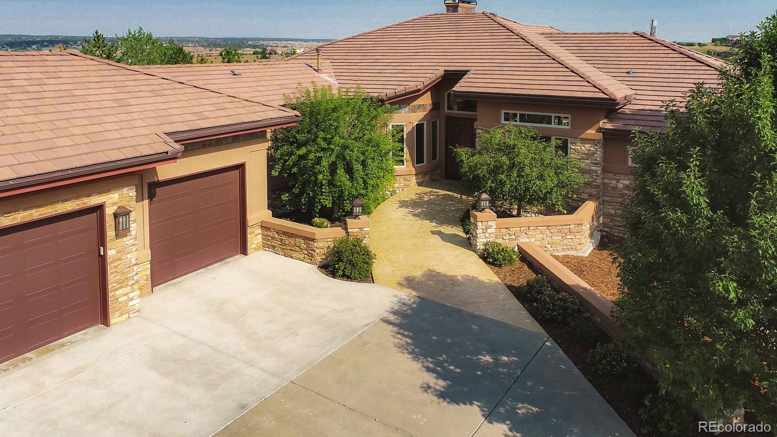 5241 Raintree Circle Parker, CO 80134 - Photo 33 of 36 a front view of a house with a yard