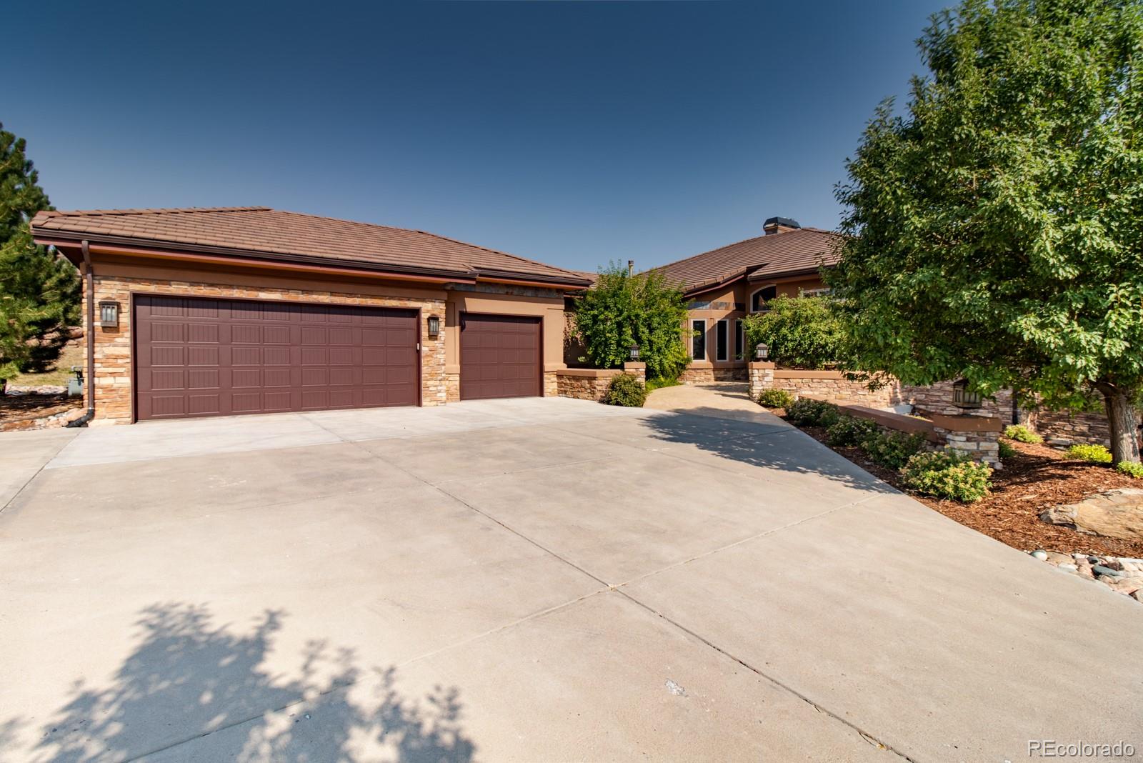 5241 Raintree Circle Parker, CO 80134 - Photo 34 of 36 a front view of a house with a yard
