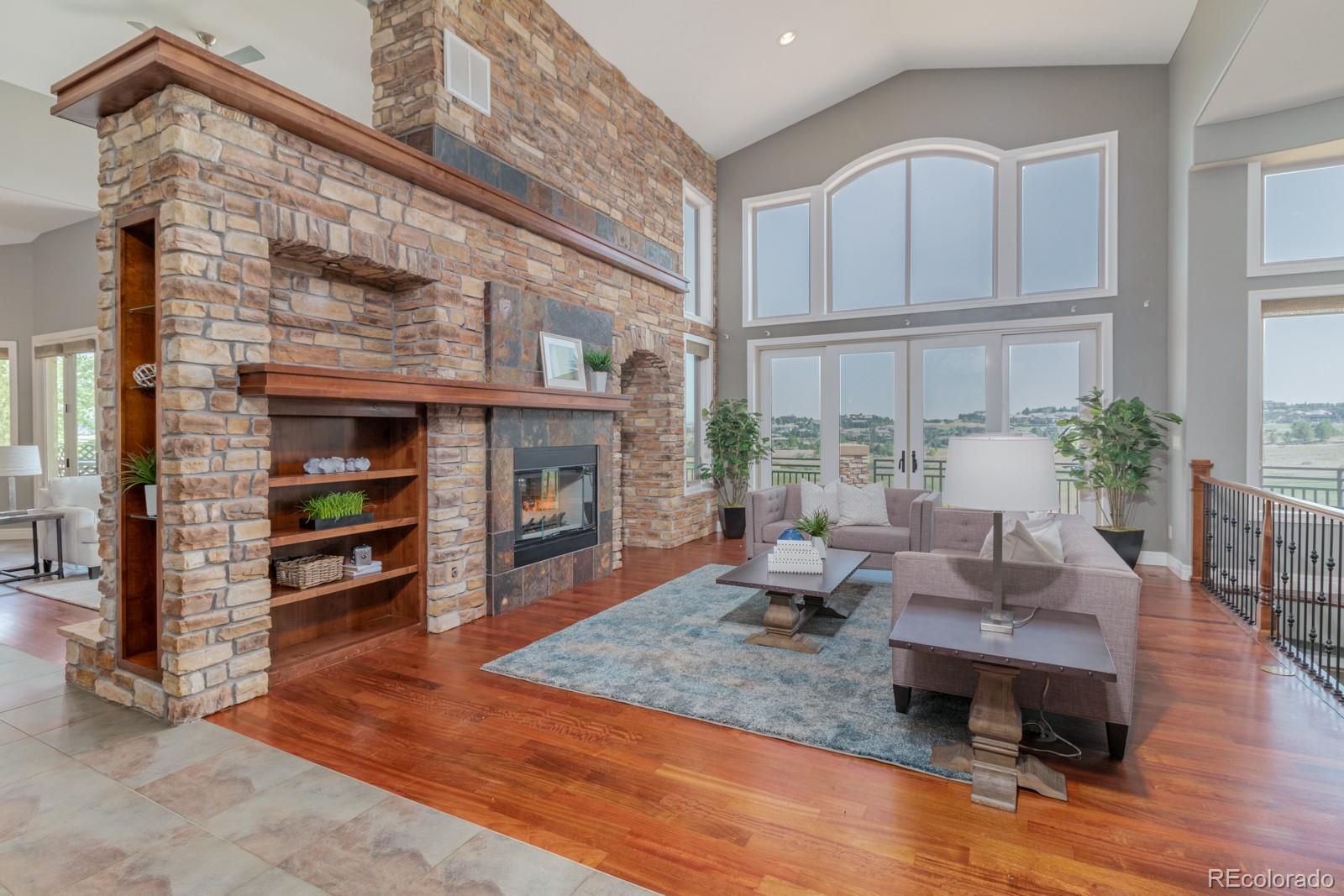 5241 Raintree Circle Parker, CO 80134 - Photo 4 of 36 a living room with furniture and a fireplace
