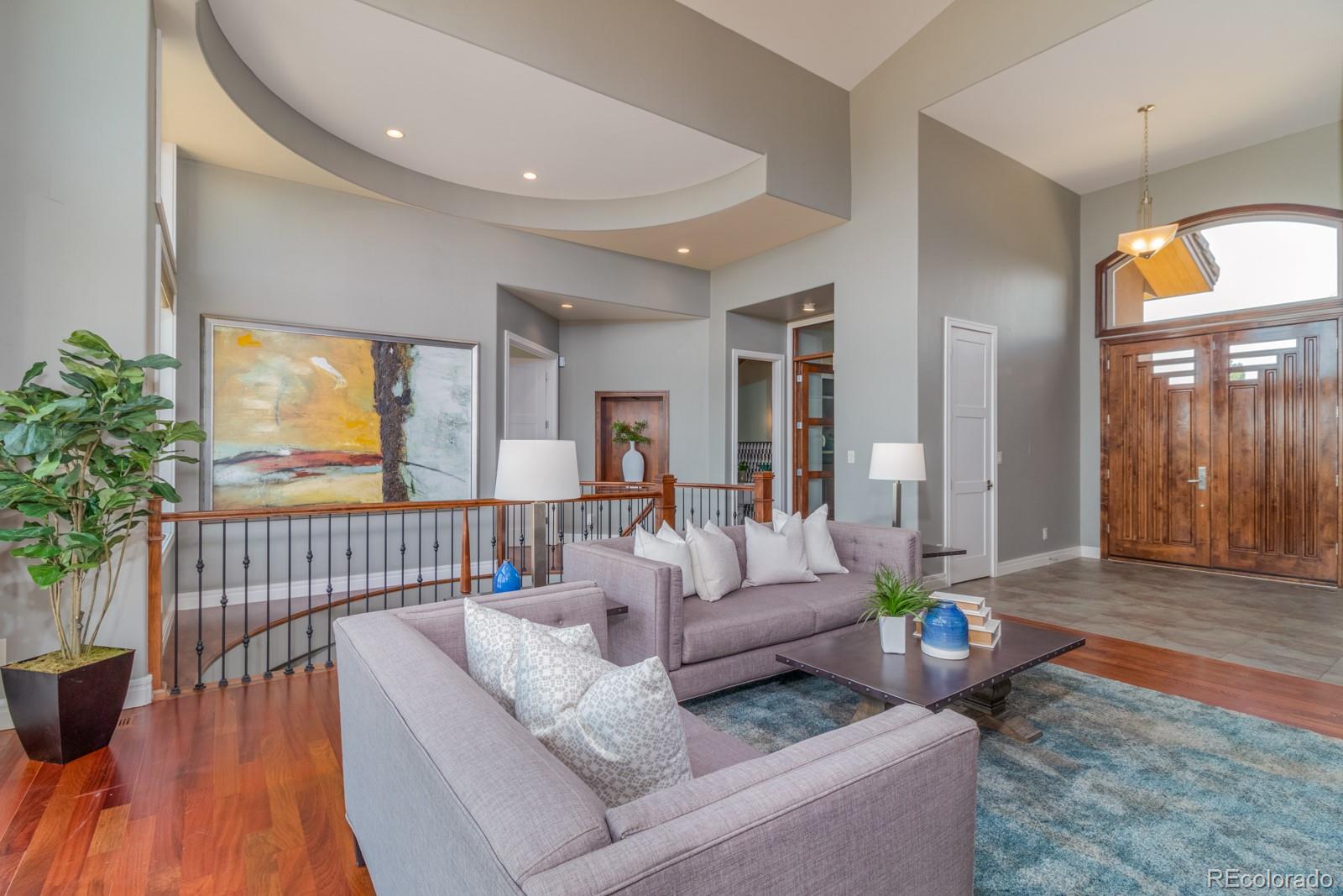 5241 Raintree Circle Parker, CO 80134 - Photo 5 of 36 a living room with furniture and wooden floor