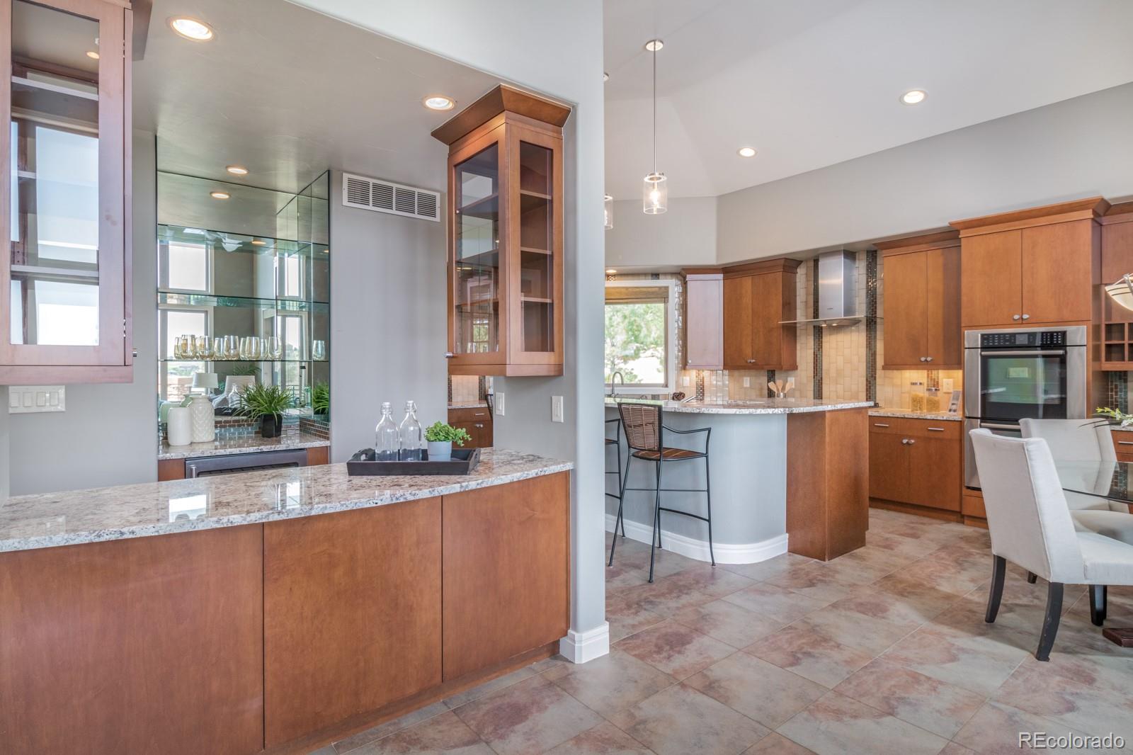 5241 Raintree Circle Parker, CO 80134 - Photo 8 of 36 a kitchen with counter top space and windows