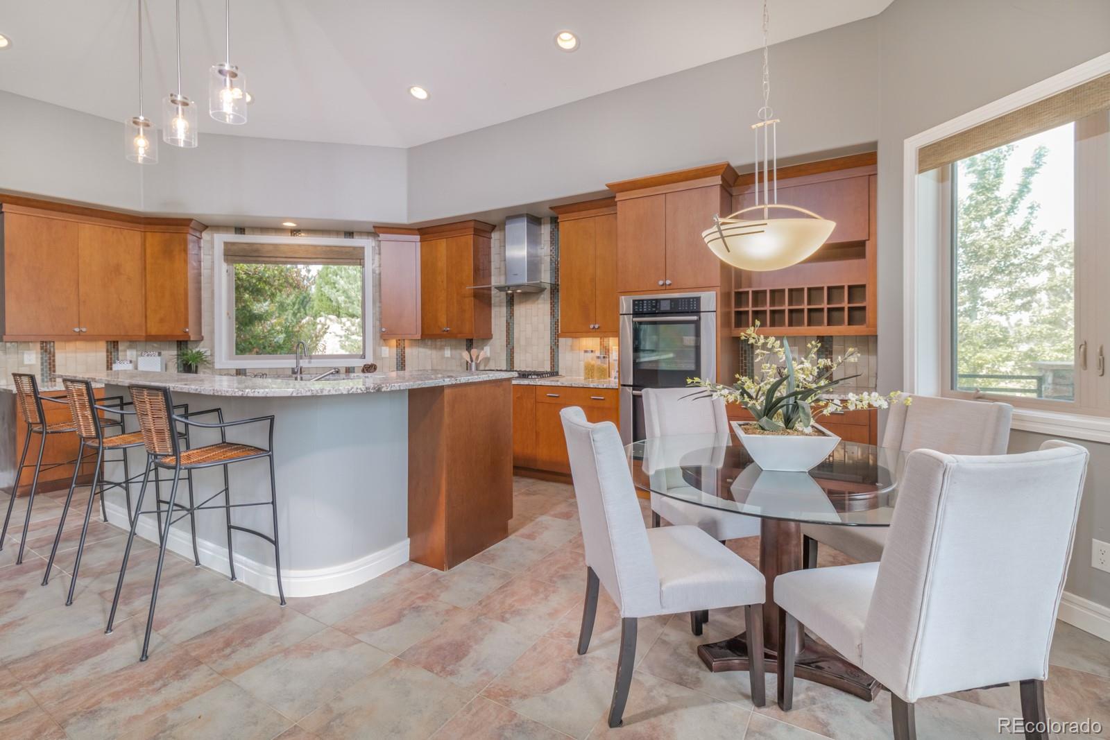 5241 Raintree Circle Parker, CO 80134 - Photo 9 of 36 a view of a dining room with furniture window and outside view