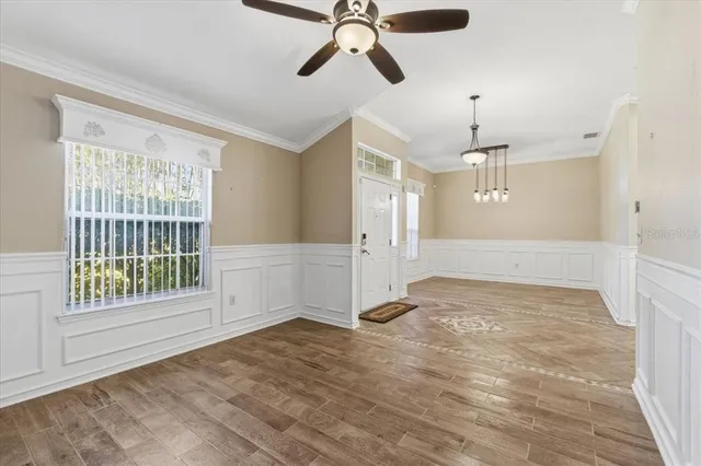 a kitchen with stainless steel appliances granite countertop a sink a refrigerator and a window