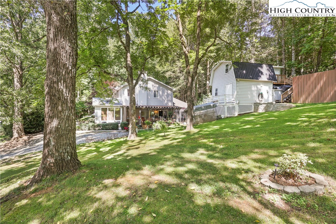1848 Howard's Creek Road Boone, NC 28607 - Photo 2 of 49 a front view of a house with a yard