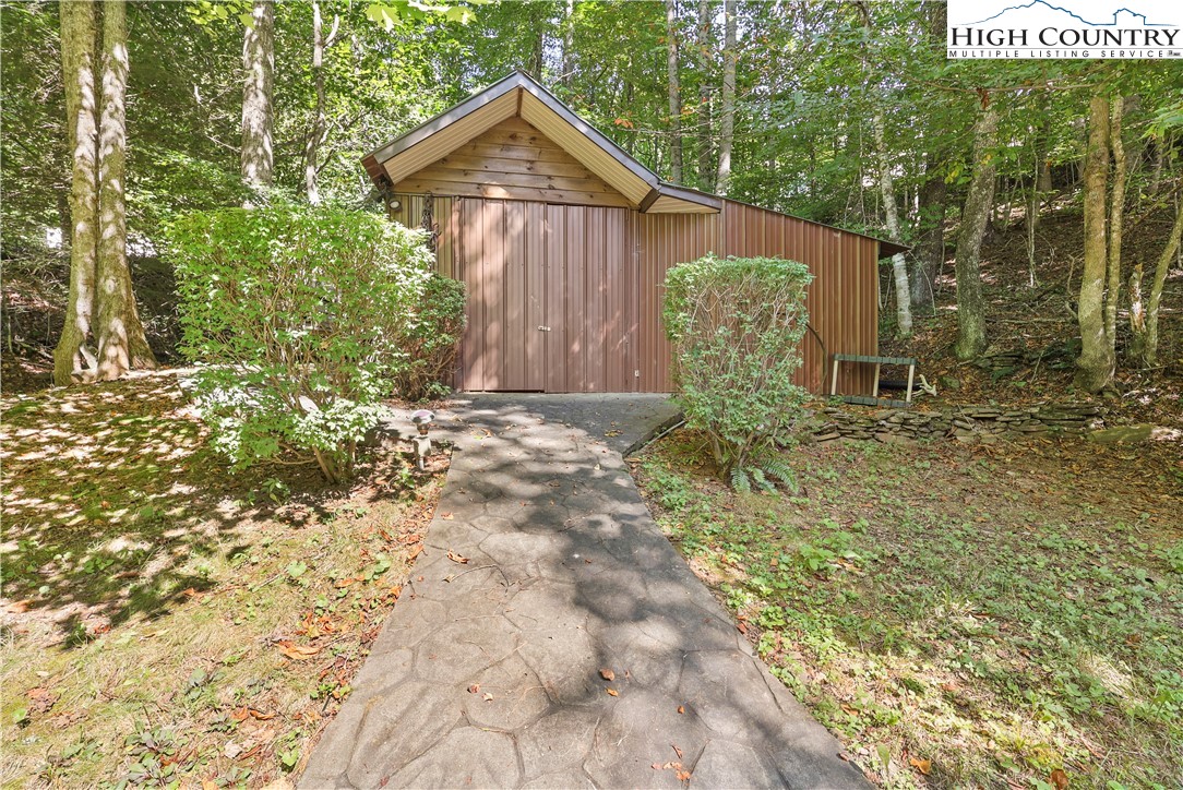 1848 Howard's Creek Road Boone, NC 28607 - Photo 44 of 49 a view of a tiny house with large trees