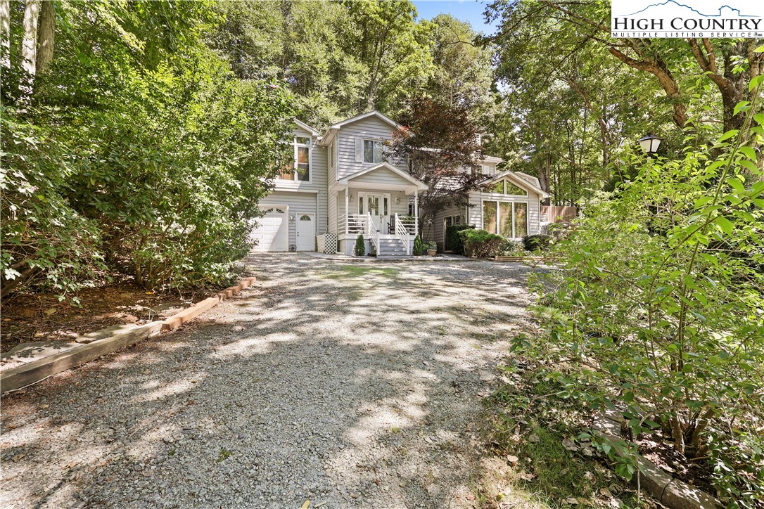 1848 Howard's Creek Road Boone, NC 28607 - Photo 49 of 49 a front view of a house with a garden