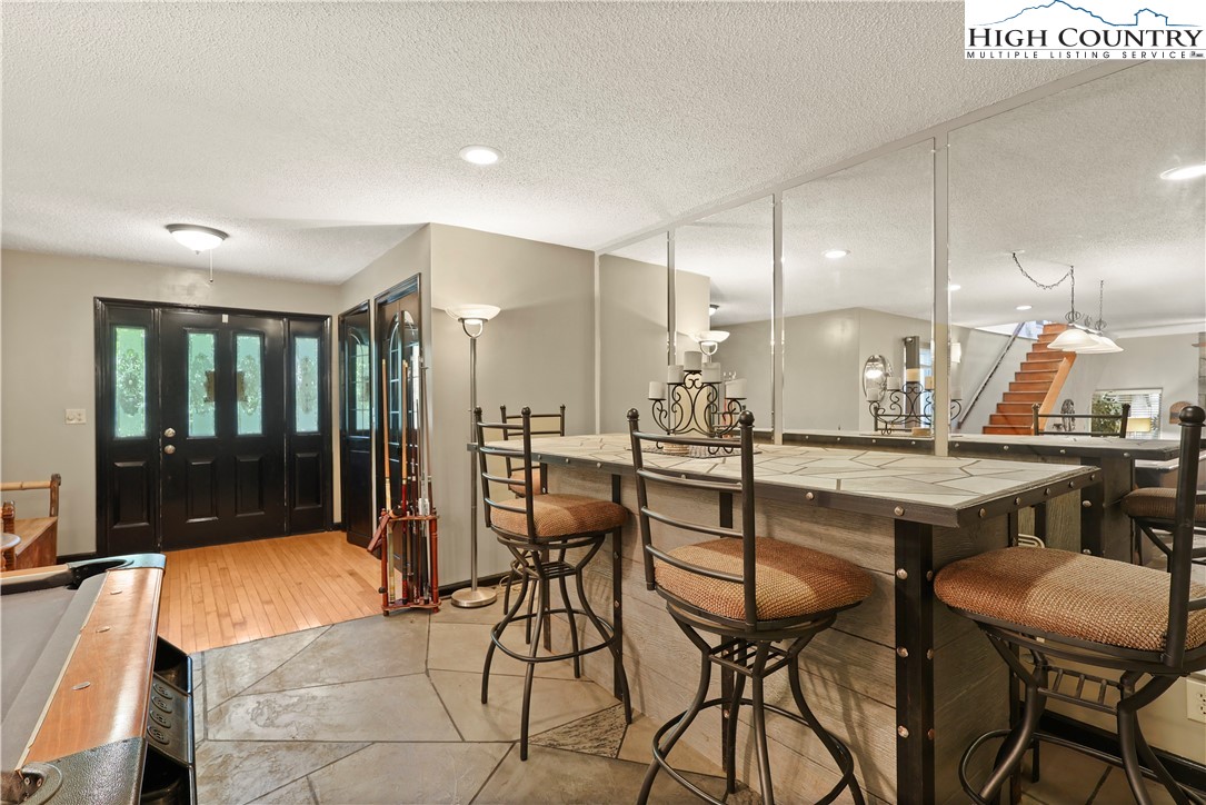 1848 Howard's Creek Road Boone, NC 28607 - Photo 9 of 49 a view of a kitchen with a table and chairs