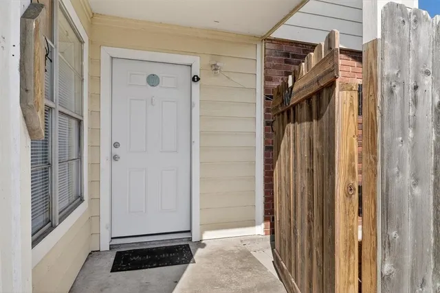 a view of empty room with fireplace and fan