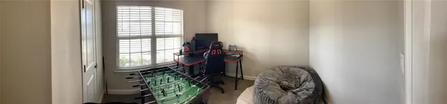 a view of walk in closet with clothes