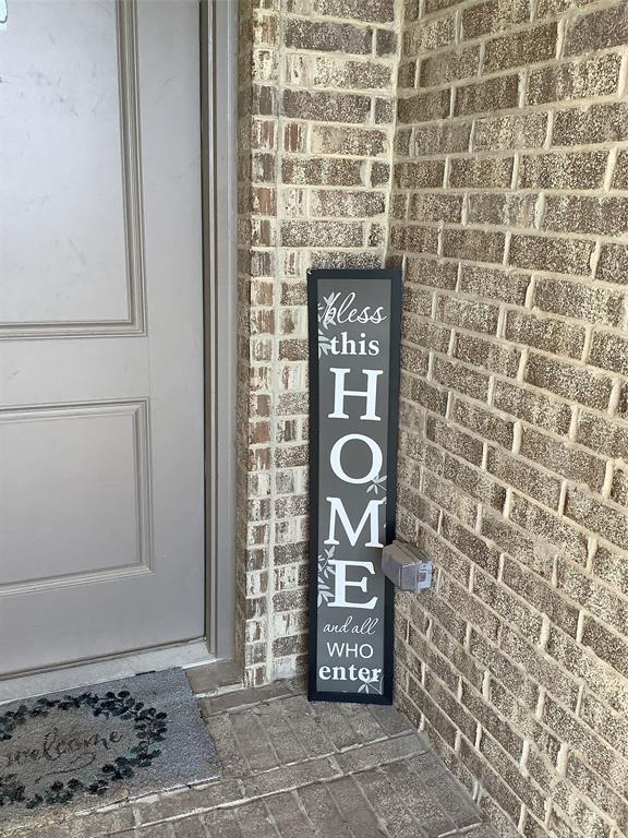 156 Hawksbill Lane Rhome, TX 76078 - Photo 19 of 19 a brick building with a sink and a mirror